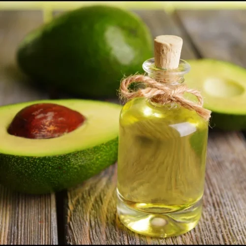 Halfed-Avocado-fruit-and-Avocado-Oil-on-Wooden-Table